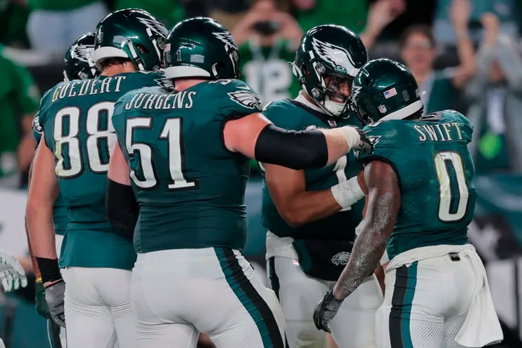 Philadelphia Eagles running back D'Andre Swift celebrates with Philadelphia Eagles quarterback Jalen Hurts after his touchdown in the fourth quarter against the Minnesota Vikings at Lincoln Financial Field on Thursday, Sep. 14, 2023, in Philadelphia, PA.