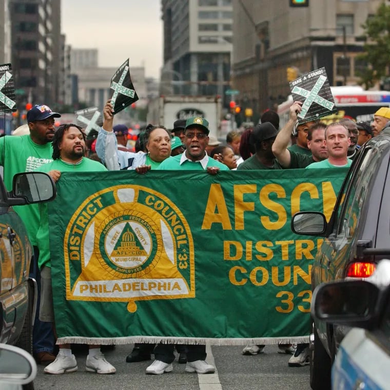 AFSCME District Council 33 members block Market Street in front of City Hall during a 2004 protest.