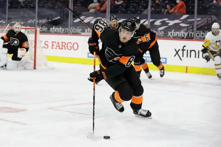Flyers left winger Joel Farabee skates with the puck against the Pittsburgh Penguins on May 3. He signed a six-year extension Thursday.