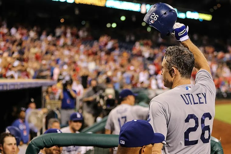 The Dodgers' Chase Utley takes a curtain call at Citizens Bank Park after hitting a grand slam against the Phillies.