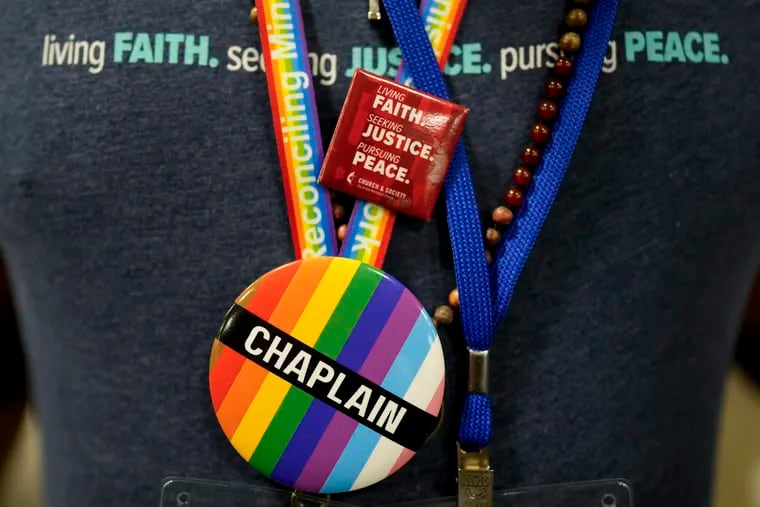 A convention-goer wears a button supporting LGBTQ clergy at the United Methodist Church General Conference last week, in Charlotte, N.C. United Methodist delegates repealed their church’s long-standing ban on LGBTQ clergy with no debate.
