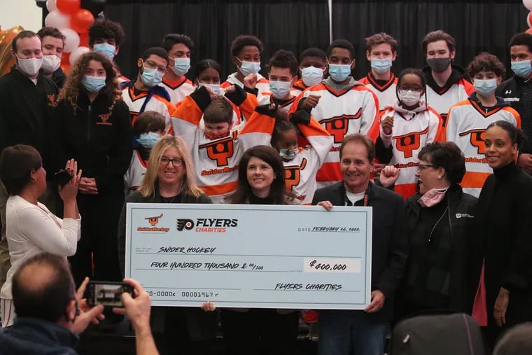 Flyers Charities presented the Ed Snider Youth Hockey Foundation with a $400,000 check on Saturday for the construction of a multi-purpose outdoor street hockey rink in Kensington.