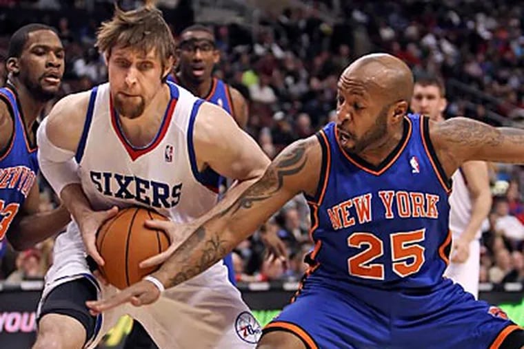 Andres Nocioni keeps the ball from the Knicks' Anthony Carter during the second quarter. (Steven M. Falk/Staff Photographer)