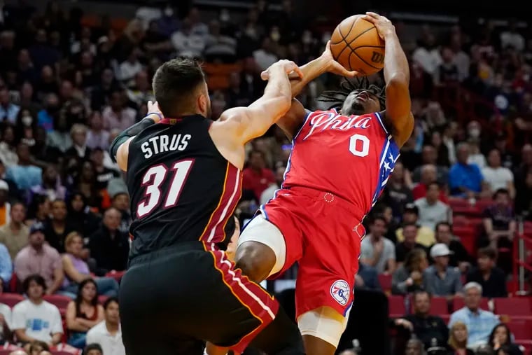 Miami Heat guard Max Strus (31) fouls Sixers guard Tyrese Maxey during the first half Saturday's game.
