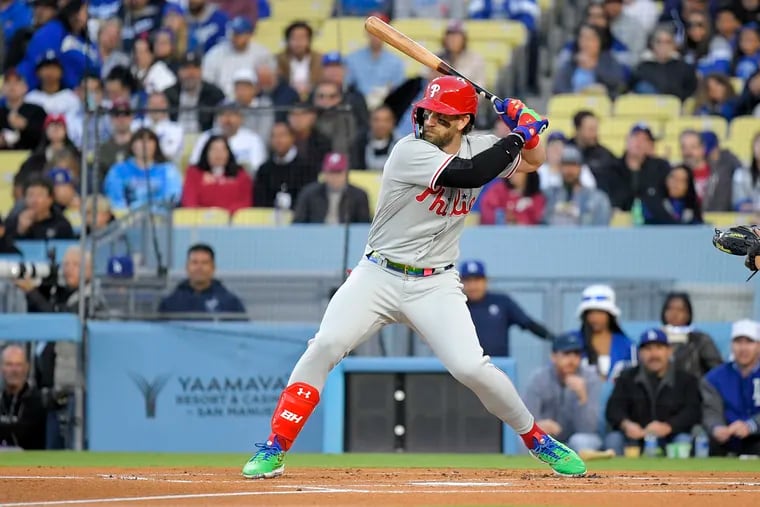 The Phillies' Bryce Harper bats in the first inning against the Los Angeles Dodgers on Tuesday, marking his first at-bat of 2023.