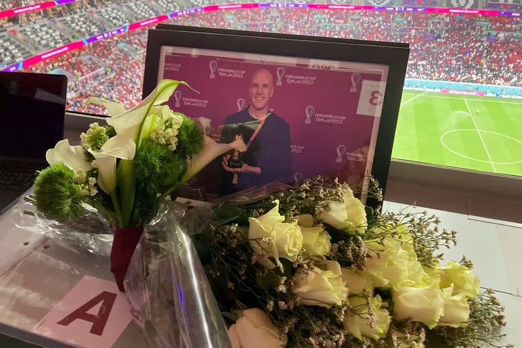 A tribute to journalist Grant Wahl is seen on his previously assigned seat at the World Cup quarterfinal soccer match between England and France, at the Al Bayt Stadium in Al Khor, Qatar, on Saturday, Dec. 10, 2022.