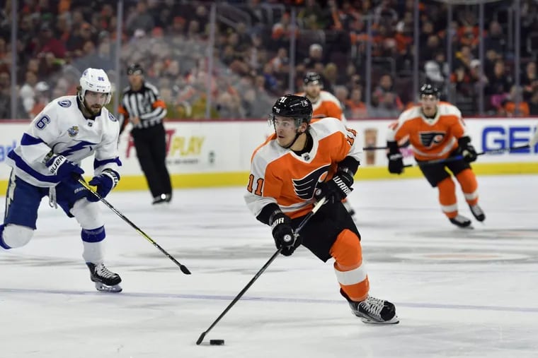 Travis Konecny skates with the puck during Thursday’s loss to Tampa Bay.