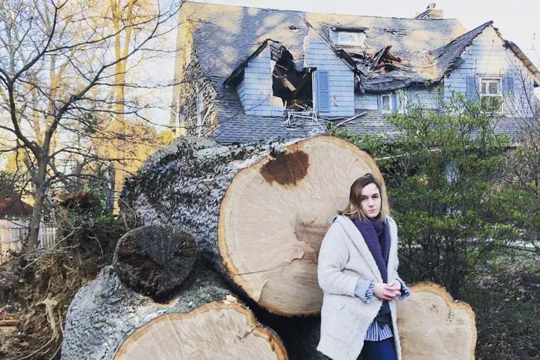 Courtenay Harris Bond in front of what's left of the tree that destroyed the second and third floors of her house in Bala Cynwyd on March 2, 2018.