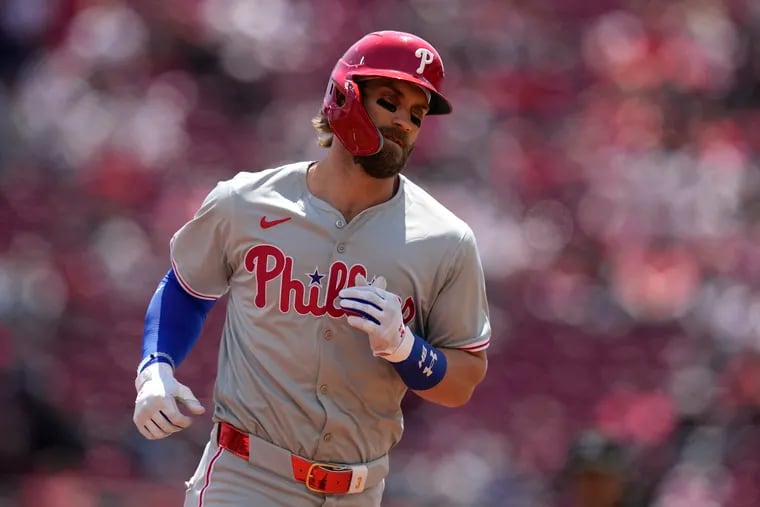 Phillies first baseman Bryce Harper rounds the bases after hitting a two-run home in the third inning against the Reds.
