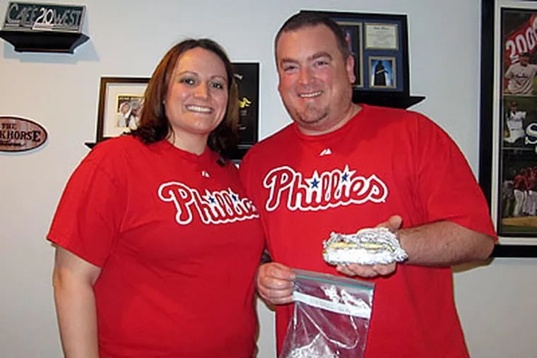 Steve and Mary Dunne have preserved a hot dog that Steve bought at Veterans Stadium in 2003, (Olivia Kram/For the Daily News)