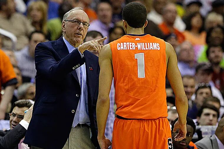 Syracuse head coach Jim Boeheim talks with guard Michael Carter-Williams. (Alex Brandon/AP)