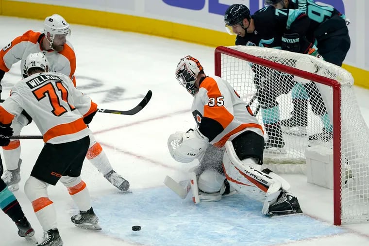 Philadelphia Flyers goaltender Martin Jones (35) eyes the puck during the first period of the team's NHL hockey game against the Seattle Kraken, Wednesday, Dec. 29, 2021, in Seattle. (AP Photo/Ted S. Warren)