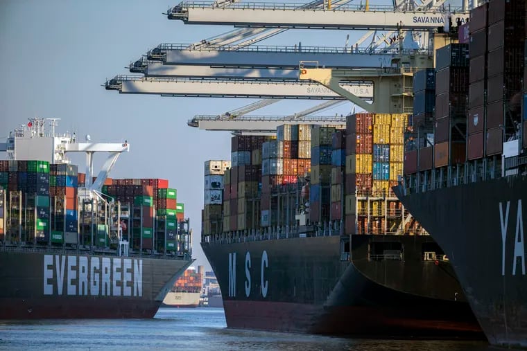 Container ship Ever Far, left, sailed down river past the Georgia Ports Authority's Port of Savannah on Sept. 29, 2021, in Savannah, Ga. Inflation has spiked during the recovery from the pandemic recession as Americans have ramped up spending on such items as cars, furniture and appliances.