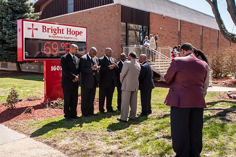 A group of deacons gathers for conversation outside after Sunday's worship service at Bright Hope Baptist Church. Some members of the congregation want Senior Pastor Kevin R. Johnson removed. Sunday, April 6, 2014, Philadelphia, Pennsylvania. ( Matthew Hall / Staff Photographer )