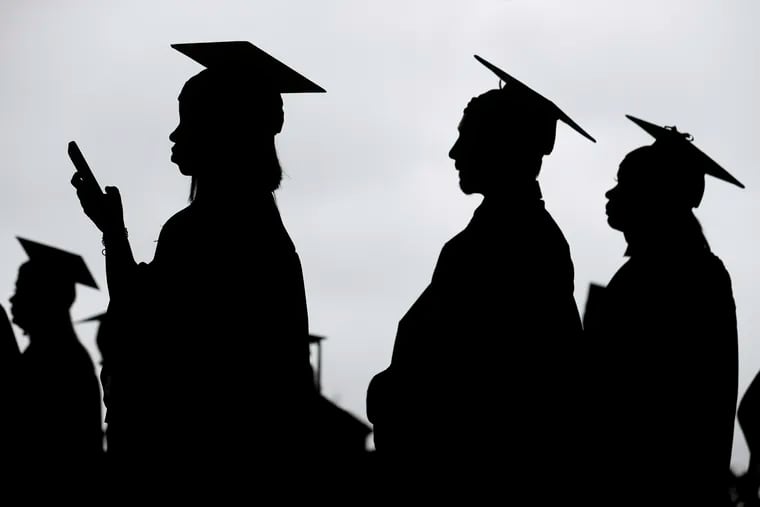 New graduates line up before the start of a community college commencement in East Rutherford, N.J., in 2018.