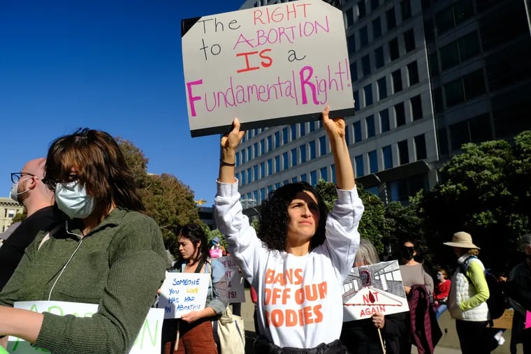 Rosamaria Cavalho holds a sign during an abortion rights protest Tuesday in San Francisco.