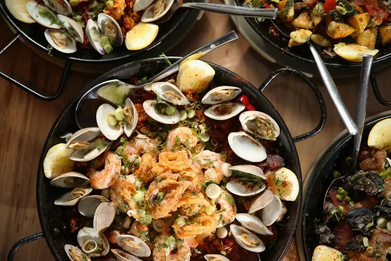 Various paellas, including the seafood paella, are pictured at Oloroso in Center City Philadelphia.