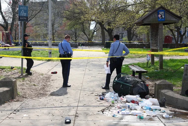 Trash cans knocked over from people fleeing a shooting at Clara Muhammad Square in Philadelphia on Wednesday, April 10, 2024