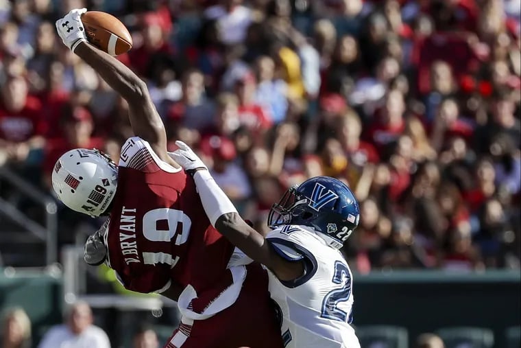 Temple wide receiver Ventell Bryant tries to catch the football during the second-quarter against Villanova defensive back Jaquan Amos on Saturday, September 9, 2017 in Philadelphia. Amos was called for a pass interference penalty on the play. YONG KIM / Staff Photographer