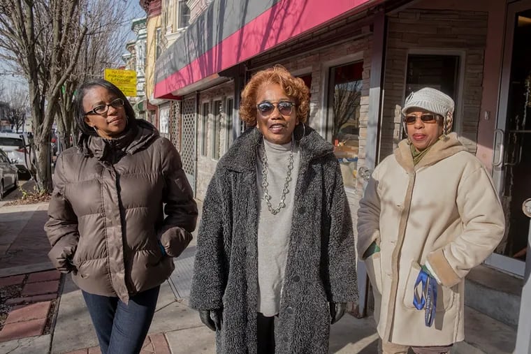 Parkside Business and Community in Partnership executive director Bridget Phifer (center) with community outreach specialists Miosha Lawrence (left) and Sheila Greene on Haddon Avenue, where the group is working to revitalize vacant properties.