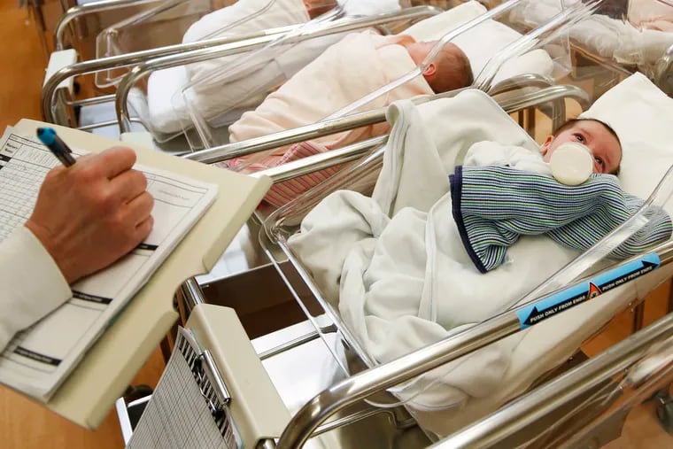 FILE - This Feb. 16, 2017 file photo shows newborn babies in the nursery of a postpartum recovery center in upstate New York. U.S. birth rates dropped for the fifth year in a row in 2019, producing the smallest number of babies in 35 years, according to numbers which were released Wednesday, May 20, 2020, by the Centers for Disease Control and Prevention. (AP Photo/Seth Wenig, File)