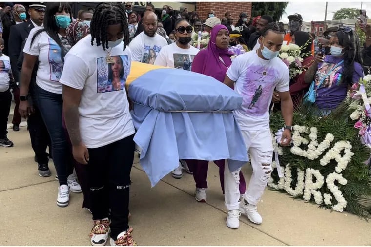 Pallbearers carry the casket of Tiffany Fletcher, the Parks and Recreation worker killed at Mill Creek Playground on Sept. 9, after her funeral service Monday.
