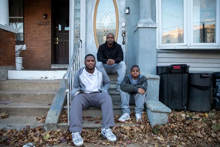 Vaughn Jackson, legal guardian to Zaveonte Winn, 17, and Xavier Winn, 14, at their home in Philadelphia in early December.