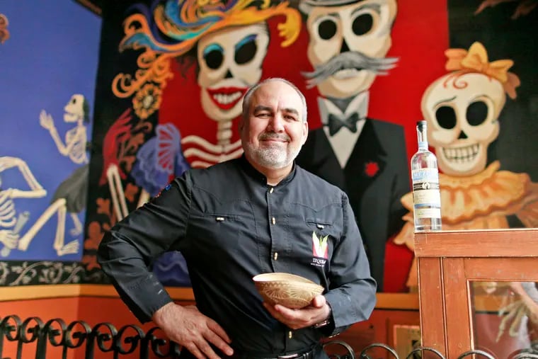 David Suro-Piñera , owner of Tequila's, uses this traditional gourd cup to drink mescal. His company, Siembra Azul, featuring highlands tequila, recently expanded into mescal. DAVID SWANSON / Staff Photographer