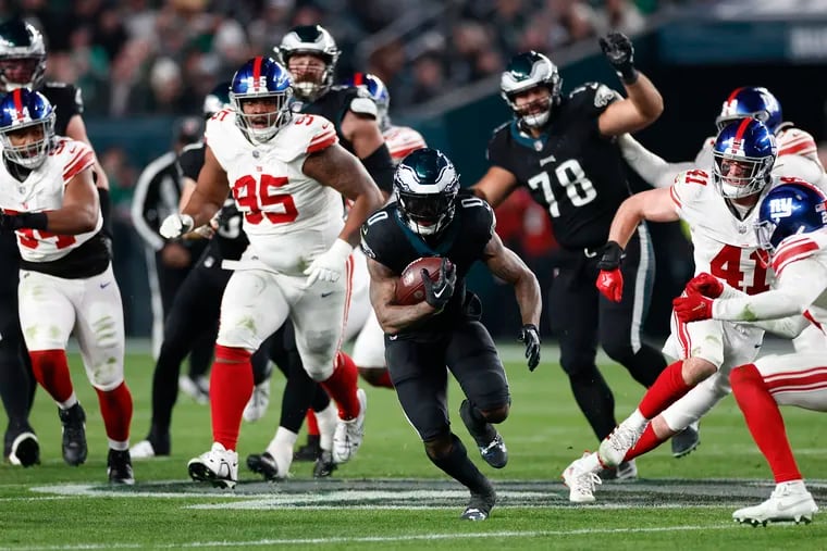 Eagles running back D'Andre Swift runs with the football against the New York Giants on Monday, Dec. 25, 2023 in Philadelphia.