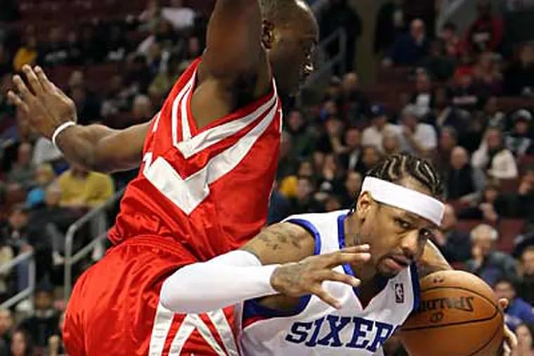 Sixers' Allen Iverson drives under Rockets' Carl Landry  during the 
2nd quarter in NBA action at the Wachovia Center, in Philadelphia,
Friday, December. 11, 2009.   ( Steven M. Falk / Staff Photographer )