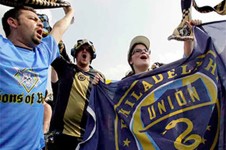 The Sons of Ben fan club celebrates before the Union took on the Seattle Sounders in its first game at the new PPL Park in Chester. (Yong Kim / Staff Photographer)