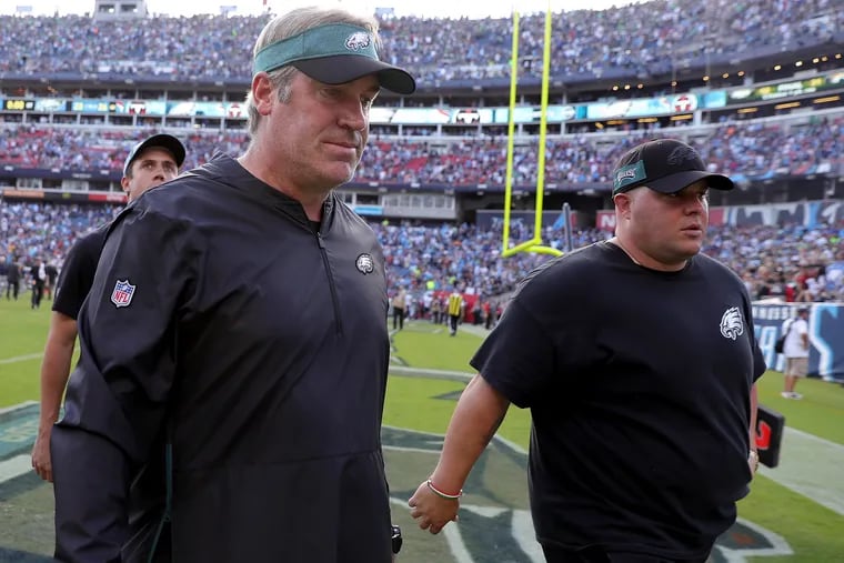 Doug Pederson walks off the field after the Eagles 26-23 overtime loss to the Titans in Nashville.
