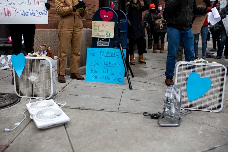 Philadelphia educators leave letters and fans outside Mayor Jim Kenney’s residence at Third and Race Streets in February to protest COVID-19 risks inside schools along with other hazardous problems.