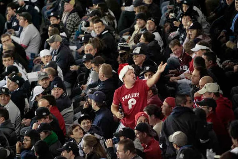 Tom Finley of Philadelphia braved the home crowd at Yankee Stadium last night, and stood out in his Santa hat. He sat in the bleachers in right field. There seemed to be fewer Phillies fans at Game 6 than at Games 1 and 2.