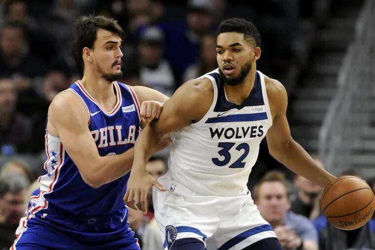 Sixers forward Dario Saric defends T-Wolves big man Karl-Anthony Towns during the team’s first matchup this season on Dec. 12.