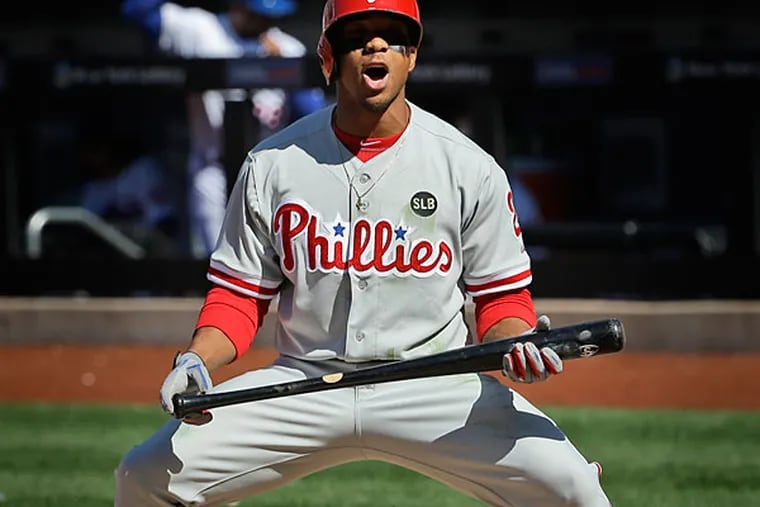 Philadelphia Phillies' Ben Revere reacts after striking out looking during the seventh inning of the baseball game against the New York Mets at Citi Field, Monday, April 13, 2015 in New York. (Seth Wenig/AP)