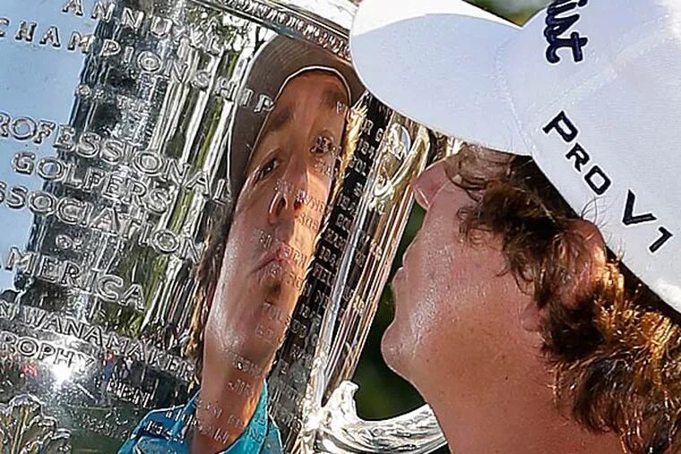 Jason Dufner kisses the Wanamaker Trophy after winning the PGA Championship. (Julio Cortez/AP)