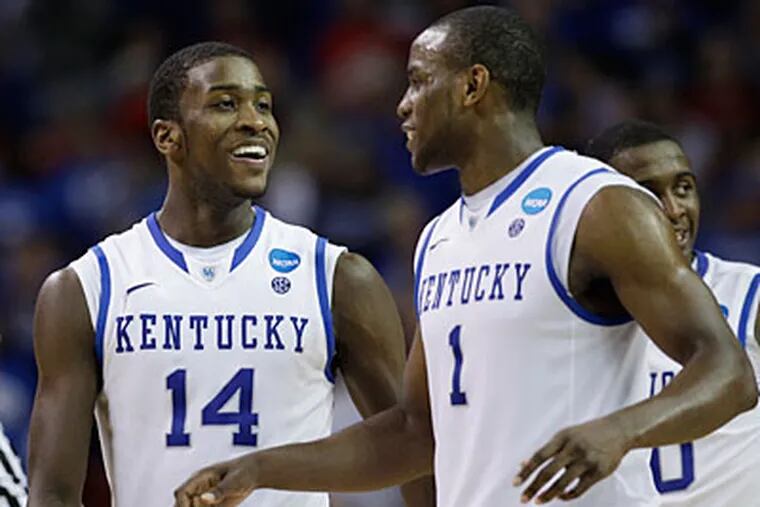 Darius Miller, left, and Michael Kidd-Gilchrist could both end up jumping to the NBA draft. (David J. Phillip/AP Photo)
