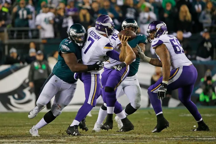 Eagles defensive tackle Fletcher Cox grabs hold of Vikings quarterback Case Keenum and affects his throw on fourth down in the fourth quarter of the 2017 NFC Championship game. The Eagles will see Keenum in Week 1 as Washington's opening-day starter.