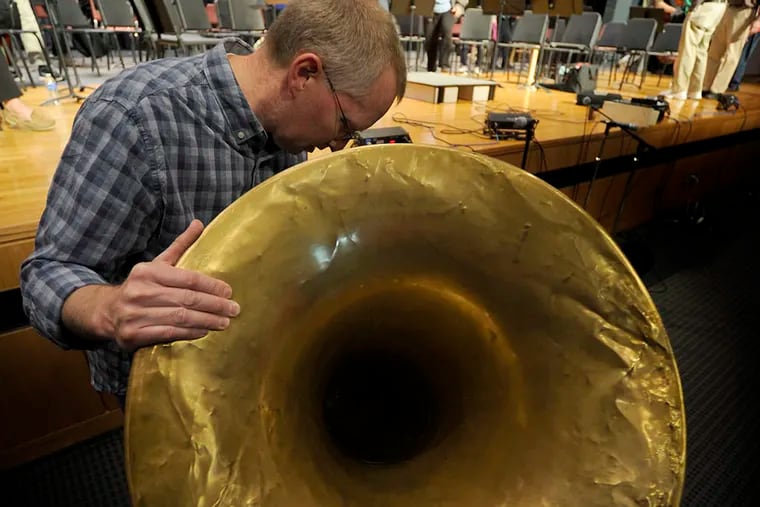 Dave Detwiler with the first sousaphone at Souderton Area High. (TOM GRALISH / Staff)