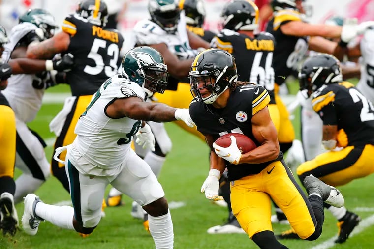 Pittsburgh Steelers wide receiver Chase Claypool runs past Eagles defensive tackle Malik Jackson during the first quarter on Sunday. Claypool scored on a 2-yard touchdown on the run play.