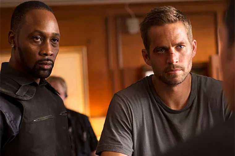 Jump street: RZA (left) and Paul Walker in the parkour retread &quot;Brick Mansions.&quot; (Philippe Bosse/Relativity Media)
