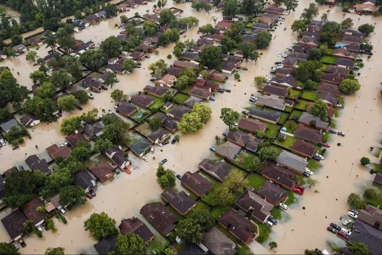 Neighborhoods in Houston after Hurricane Harvey this year. Such events only plunge the National Flood Insurance Program further into debt.