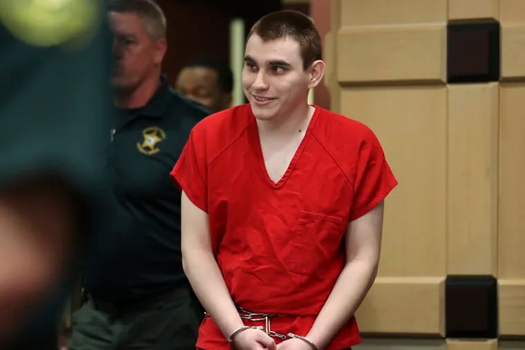Parkland school shooting suspect Nikolas Cruz enters the courtroom for a hearing at the Broward Courthouse in Fort Lauderdale, Fla., Tuesday, Jan. 15, 2019. Cruz returned to court this week for hearings on the Valentine's Day 2018 shooting at Marjory Stoneman Douglas High School in Parkland, Fla., and on accusations he assaulted a corrections officer. (Amy Beth Bennett/South Florida Sun-Sentinel via AP, Pool)