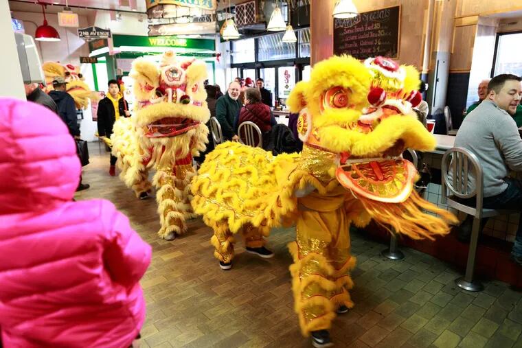 The Philadelphia Sun parade with three lions and drums, kicking off the "Year of the Monkey," during Chinese New Year at the Reading Terminal Market Saturday February 6, 2016.
