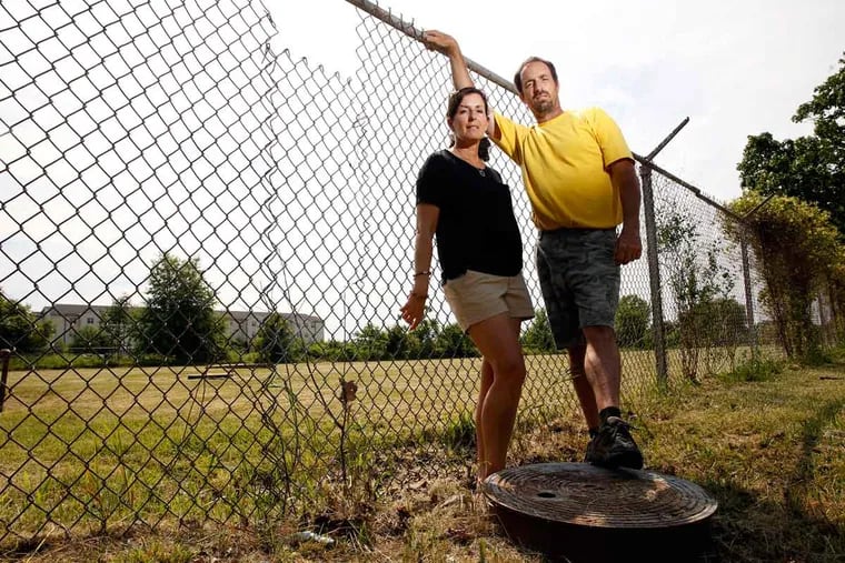 Hope Grosse and brother Chris Martindell used to climb the fence near their Warminster home to play at the Naval Air Warfare Center. Grosse says she drank the water there for years. “How long is it going to take to get out of my body?”
