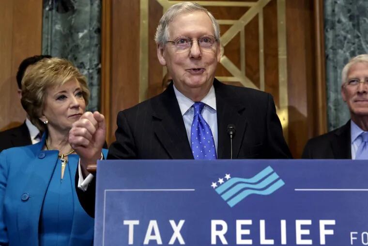 Senate Majority Leader Mitch McConnell (R., Ky.), flanked by Small Business Administration head Linda McMahon, left, and Sen. Roger Wicker (R. Miss.), speaks to a group of small-business owners.