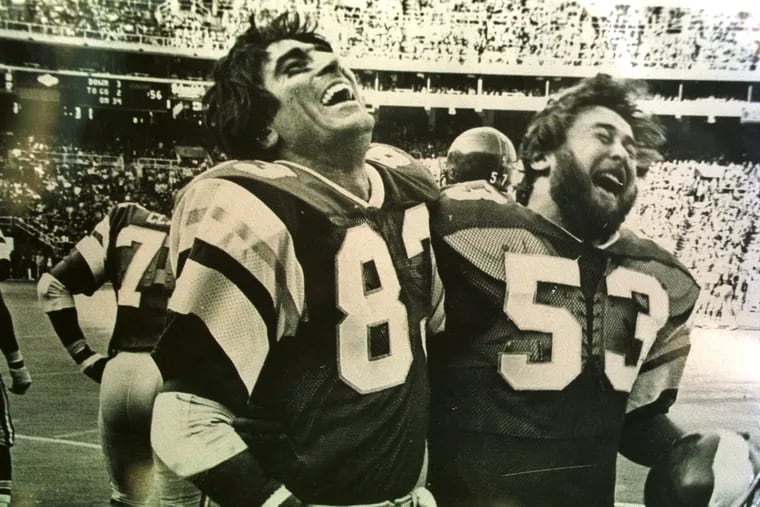 Mr. Franks (right) celebrates with friend and Eagles teammate Vince Papale in a 1977 game against Washington. Mr. Franks was a dynamic special teams player, and popular with fans and teammates.