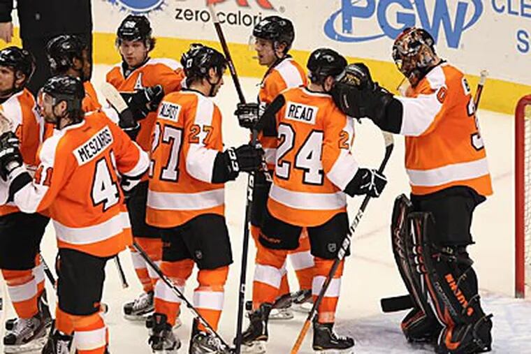 The Flyers celebrate after beating the Islanders, 6-3, on Thursday at the Wells Fargo Center. (Steven M. Falk/Staff Photographer)