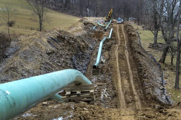 Workers install the Mariner East pipeline in Washington County, Pa.,  earlier this year.